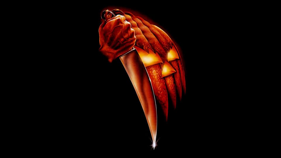 Halloween screenplay image with a knife and an evil pumpkin.