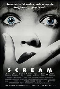 Scream movie poster with Drew Barrymore covering her mouth, looking terrified.