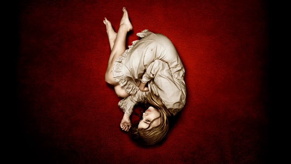 Let Me In (2008) screenplay hero image featuring a young female vampire lying in the fetal position on a blood-red carpet.