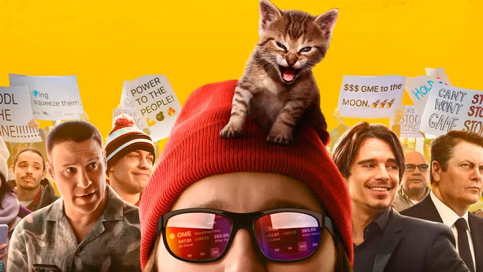 Dumb Money screenplay hero image with Paul Dano, wearing a red cap, with a kitten sitting on his head.