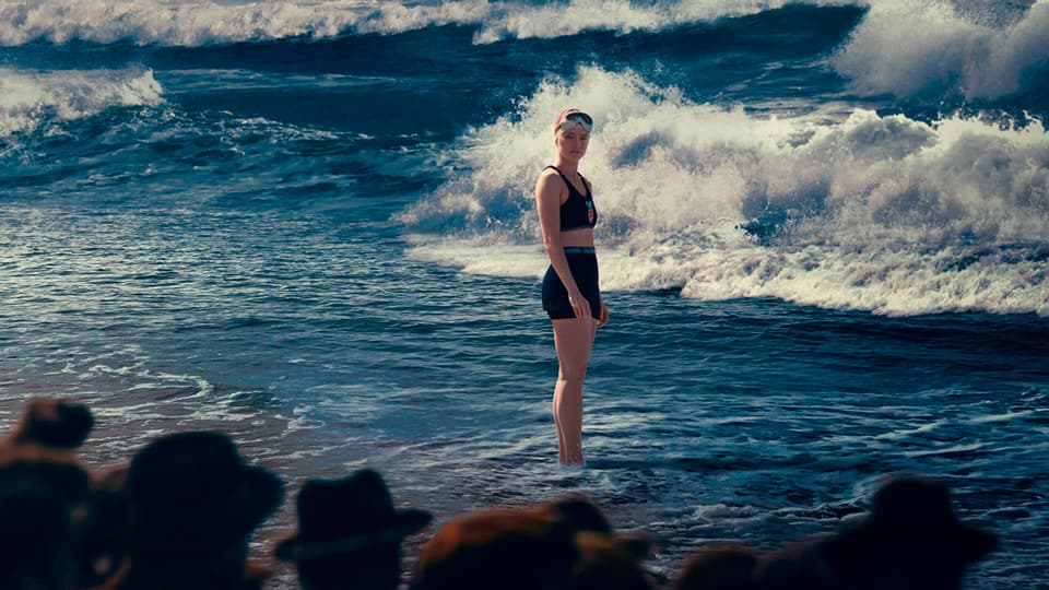 Still image from the movie 'Young Woman and the Sea', representing the screenplay.
